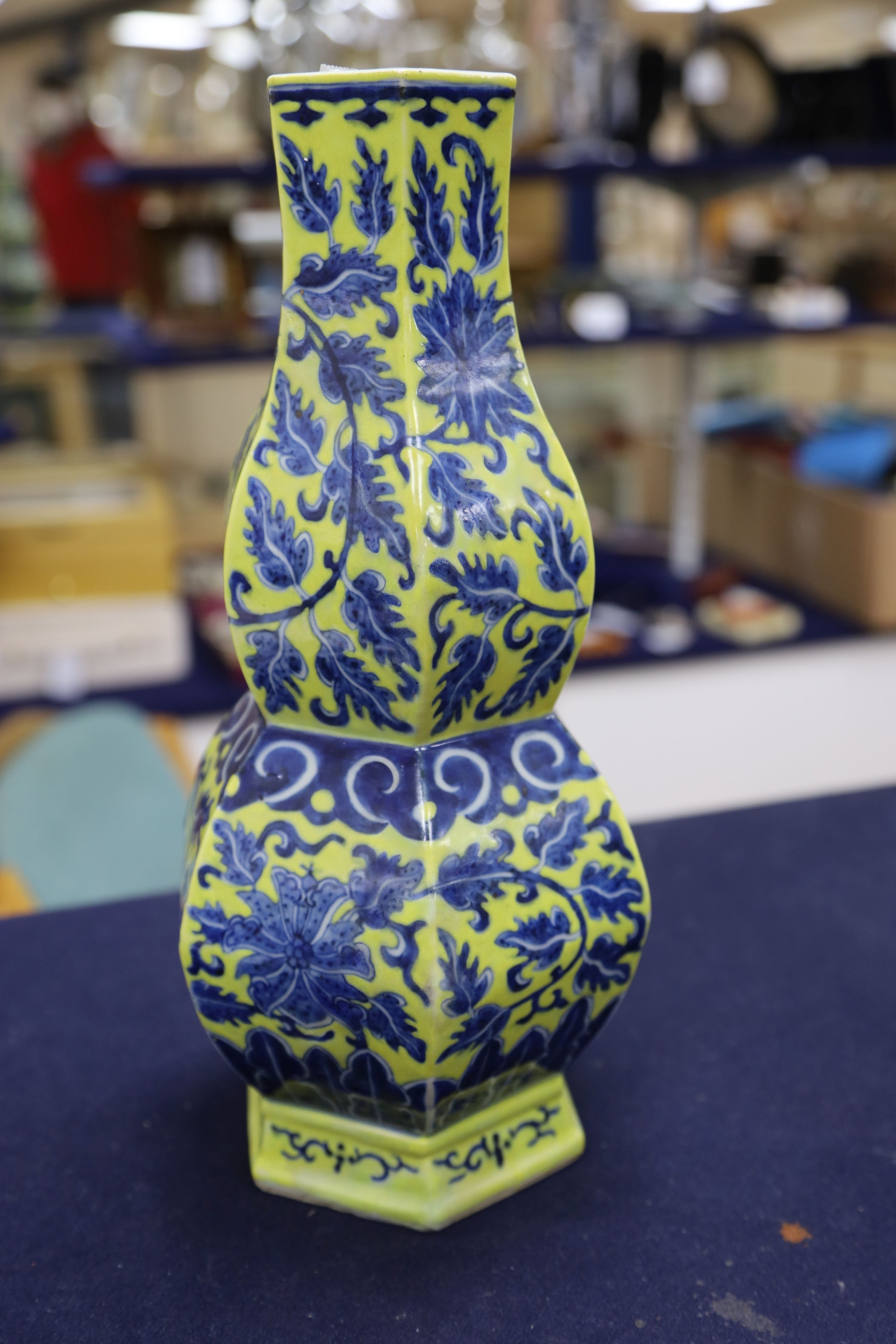 A Chinese underglaze blue yellow ground hexagonal vase, early 20th century, some restoration